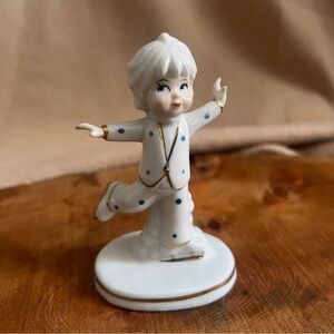 Vintage Porelain girl figurine figuring skating‎ with gold accents.